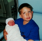 Drew holding Madi the day she was born.